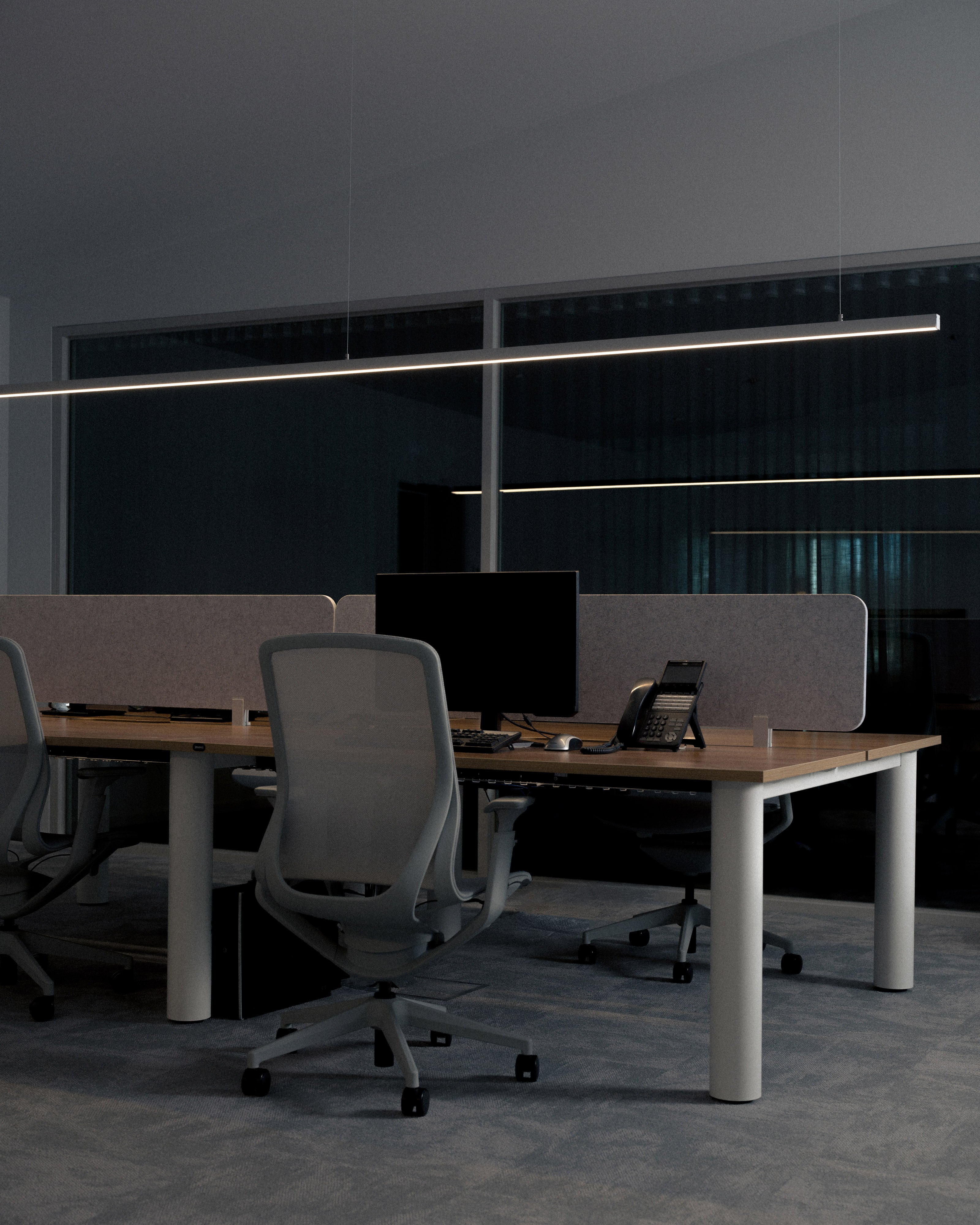 Dark moody commercial office fit-out with back-to-back workstations, acoustic desk dividers, ergonomic task chairs, timber and white desks, and linear LED pendant lighting  — commercial interior design by Studio Nicholas Noosa Queensland Australia