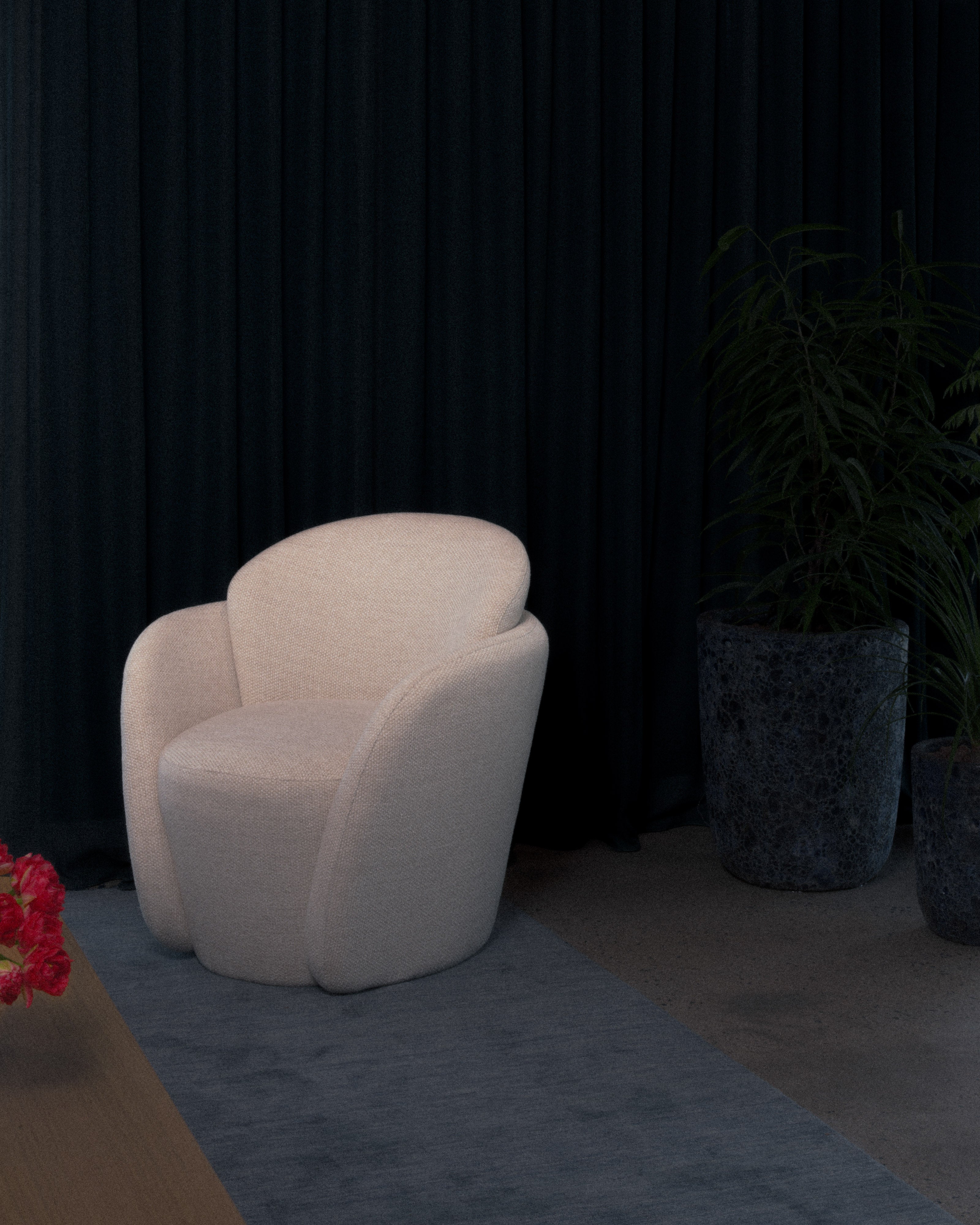Cream armchair styled against dark navy drapery with textured stone planters and indoor ferns in a moody contemporary interior — luxury furniture and interior design styling by Studio Nicholas Noosa Queensland Australia